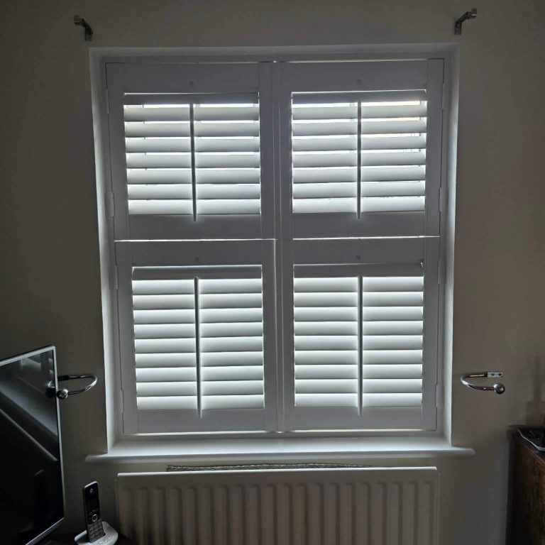 Made to measure tier on tier shutters for a living room window measured and isntalled by TrueShade Interiors