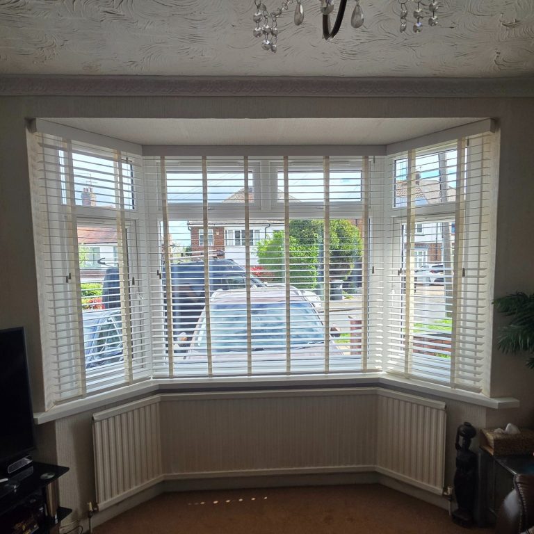 Made to measure Venetian blinds expertly installed into a bay window by TrueShade Interiors
