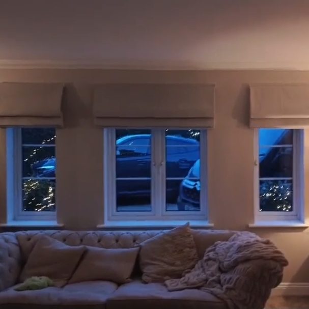 Made to measure motorised roman blinds installed in a bay window by TrueShade Interiors