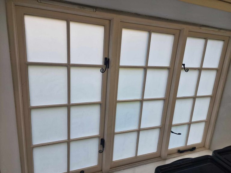 Privacy window film fitted to glazed doors to reduce glare and improve privacy
