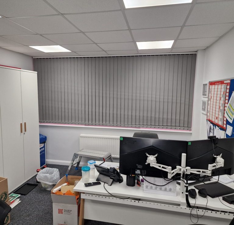 Vertical blinds installed in a commercial office spade by TrueShade Interiors