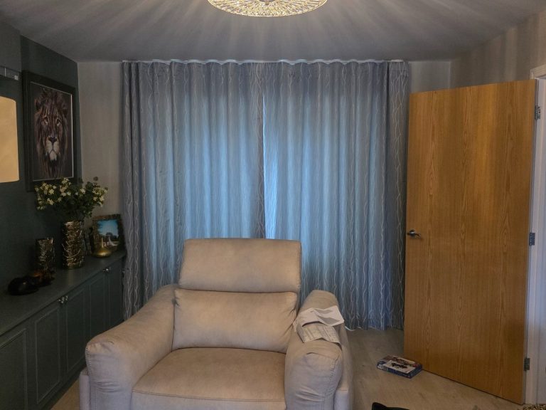 Made to measure wave curtains fitted across a full wall window for a soft, elegant finish