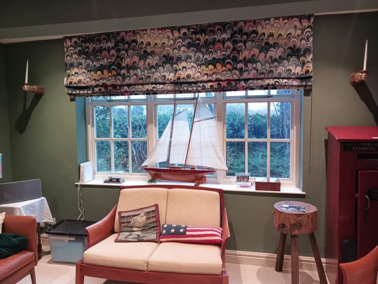 Made to measure roman blinds neatly fitted to a feature window