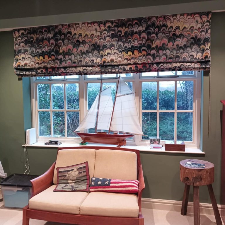 Made to measure roman blinds installed in a feature window by TrueShade Interiors