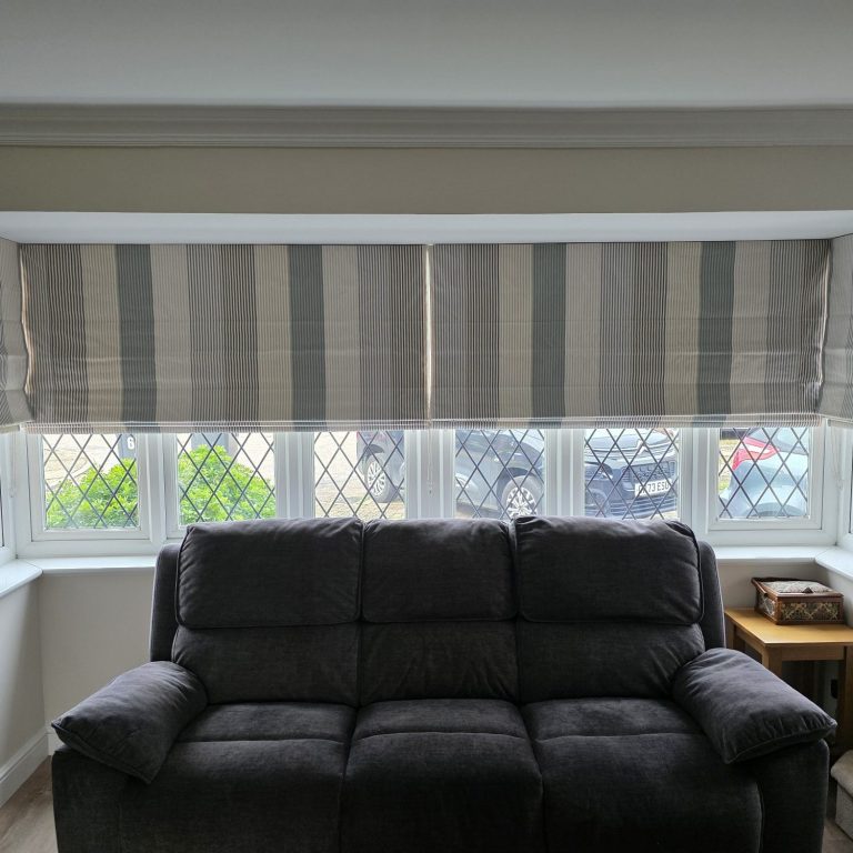 Made to measure roman blinds installed in a bay window by TrueShade Interiors