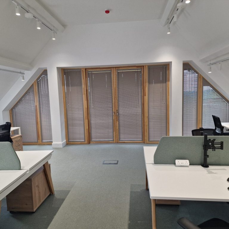 Expertly measured bespoke shaped aluminium blinds installed by TrueShade Interiors